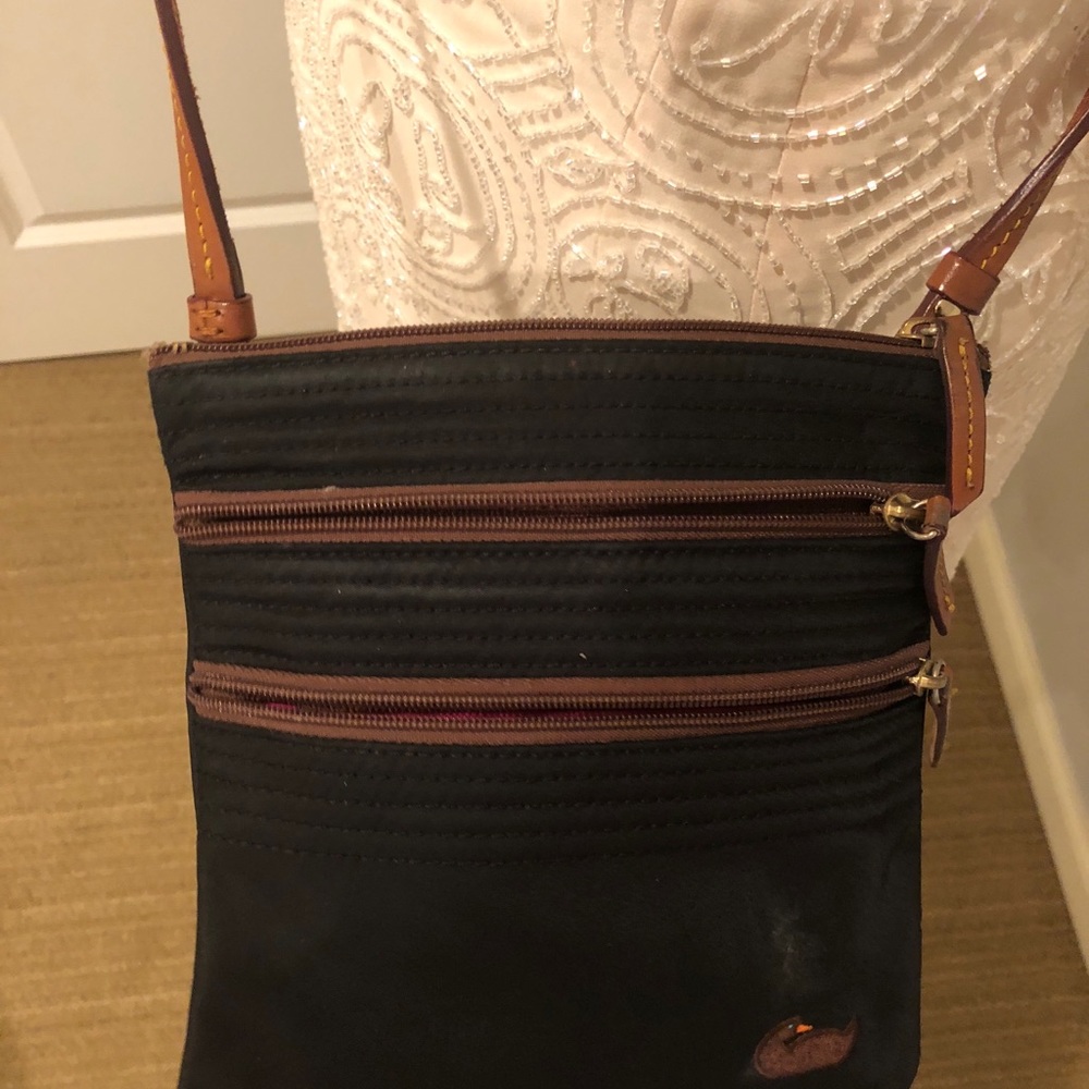 Dooney and Bourke cross body with three zippers